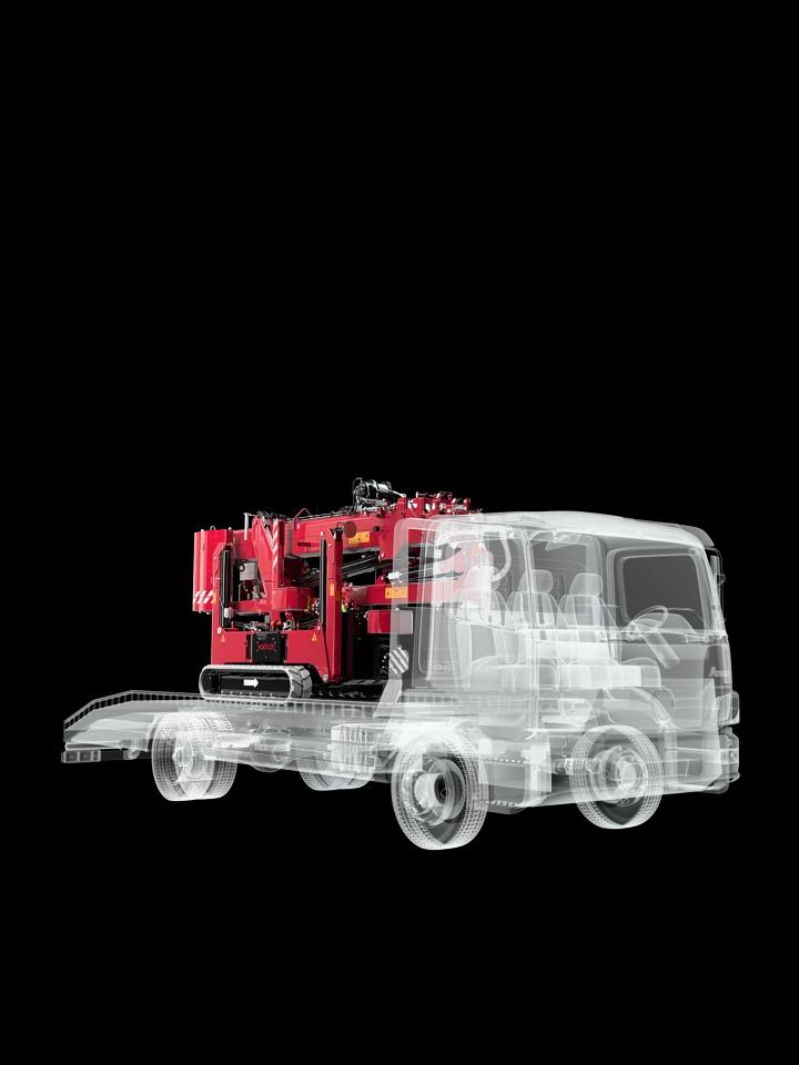 Hoeflon C10e im Transportmodus auf einem kompakten Lkw.